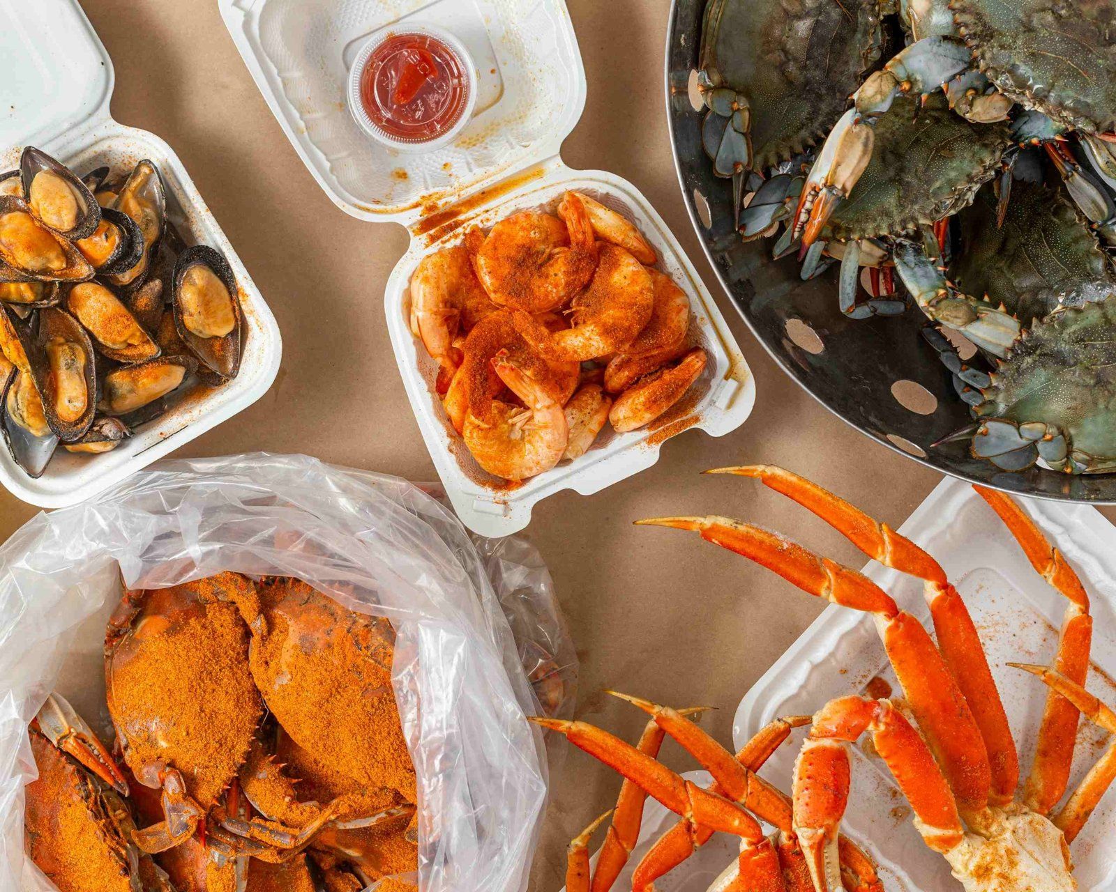 Steamed shrimp, black mussels, live and steamed blue crabs and snow crab legs from Blue Crab Express