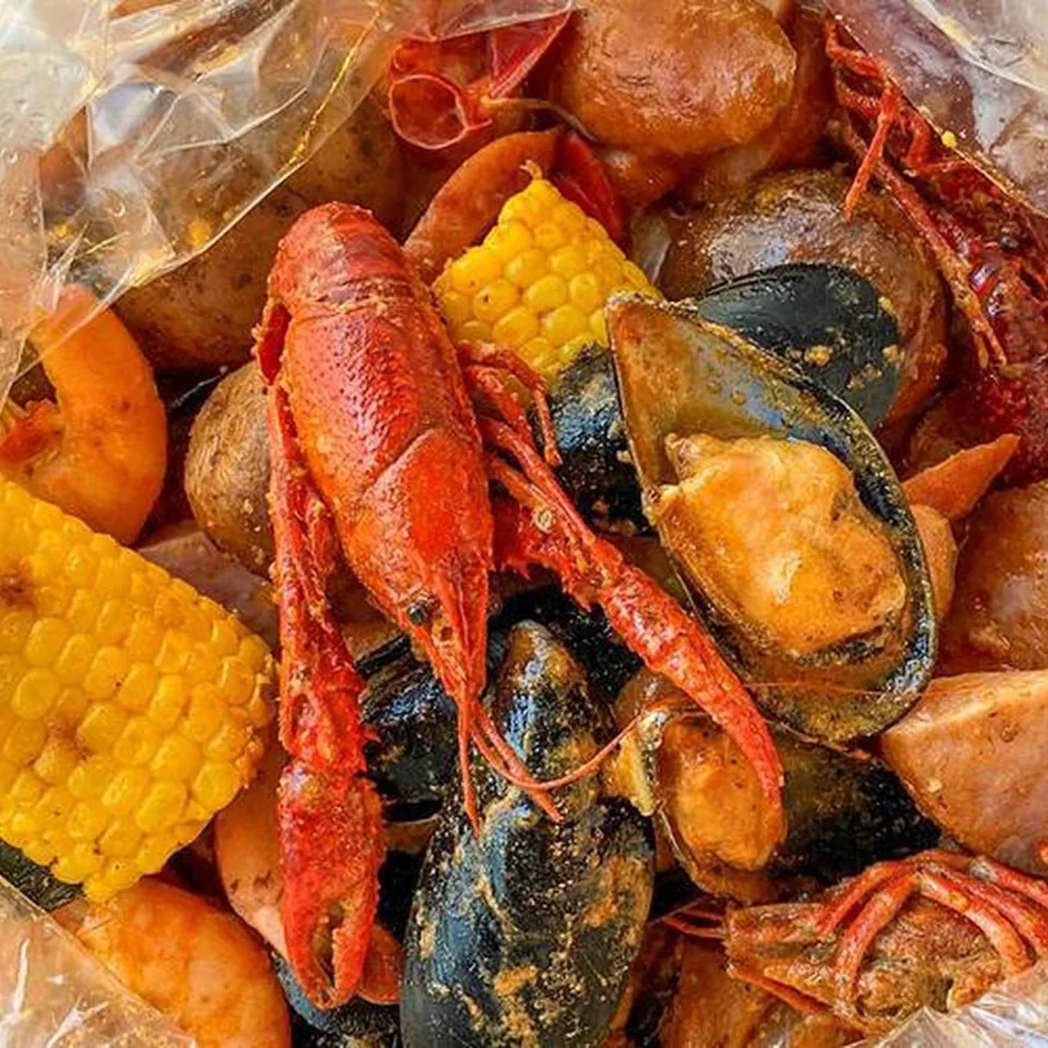 The Cajun Boil: crawfish, black mussels and shrimp in a bag with corn and potatoes