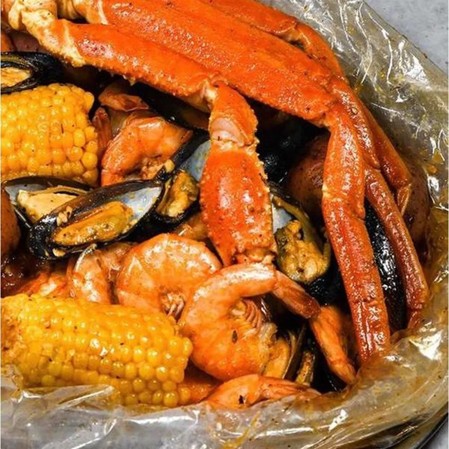 The Perfect Storm: snow crab, shrimp and mussels with corn in Cajun sauce