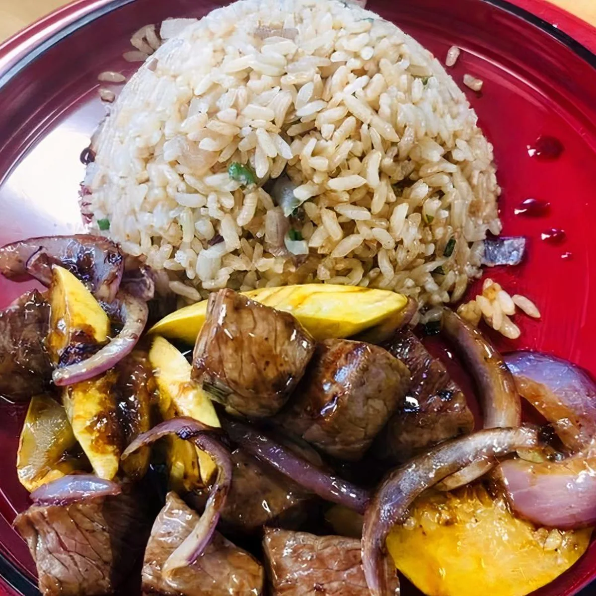 Steak hibachi with onions and fried rice
