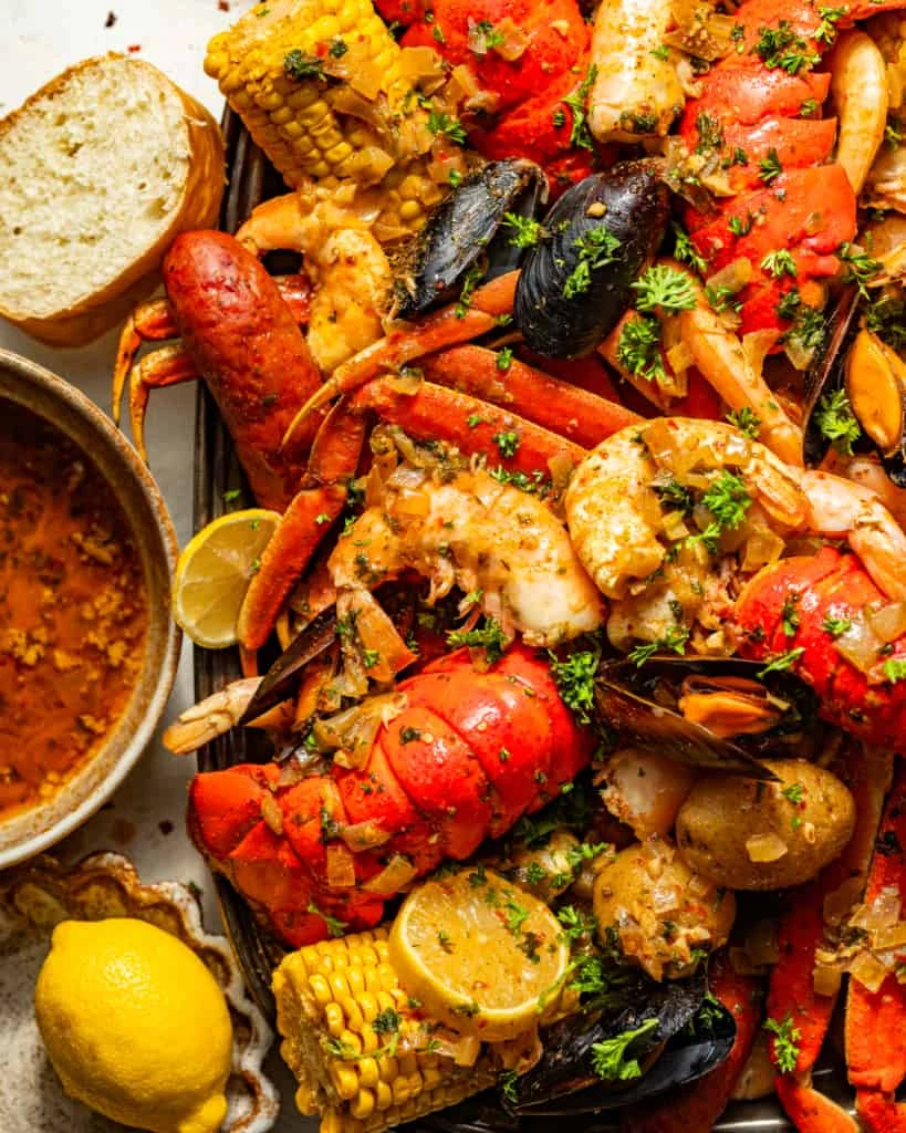 Lobster, juicy shrimp, mussels and corn tossed in a rich seafood boil